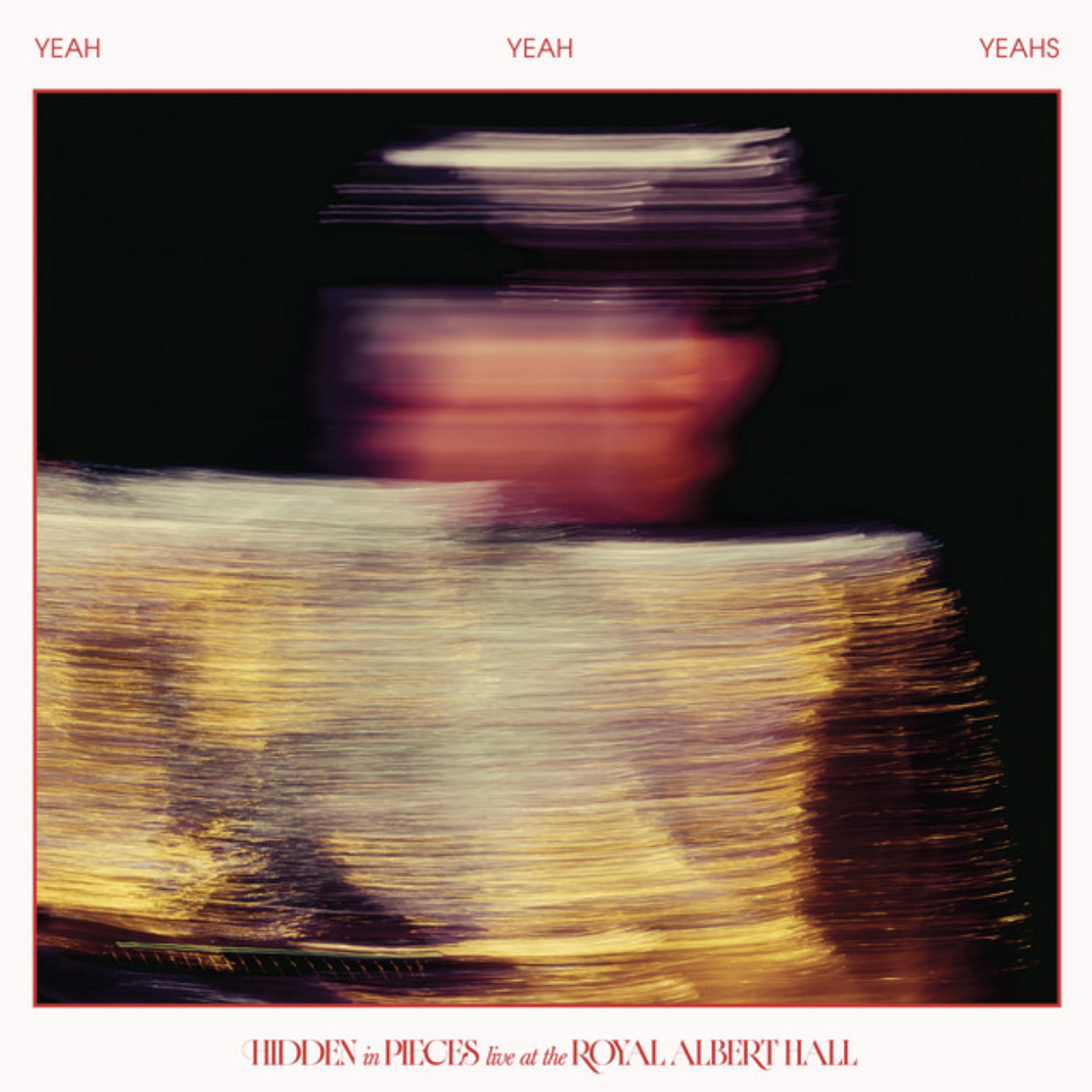 Album cover art for Yeah Yeah Yeahs Live at the Royal Albert Hall featuring motion-blurred photo of Karen O in gold outfit.